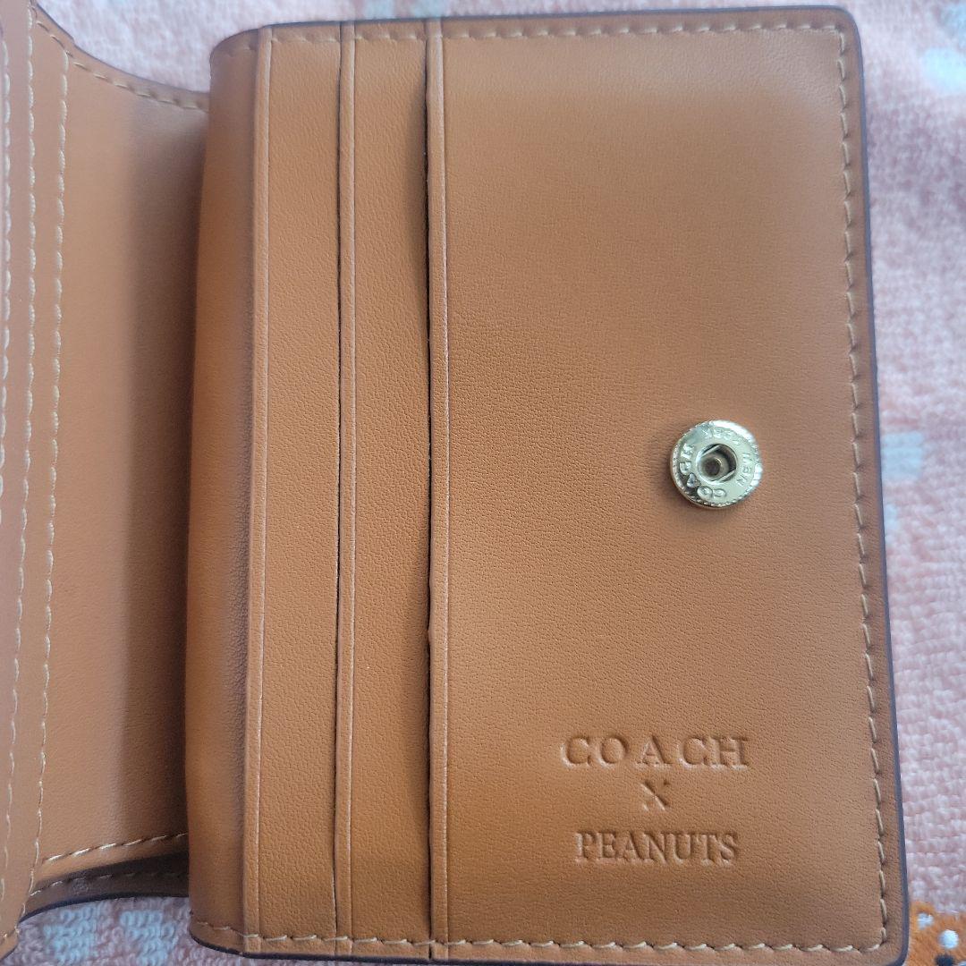 COACHコーチシグネチャースヌーピーコラボ二つ折り財布