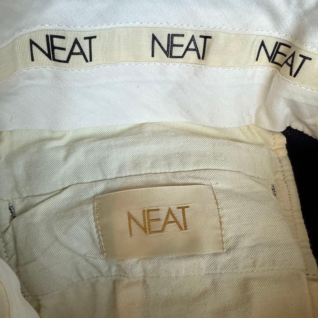 パンツ NEAT COTTON PIQUE TAPERED PANTS