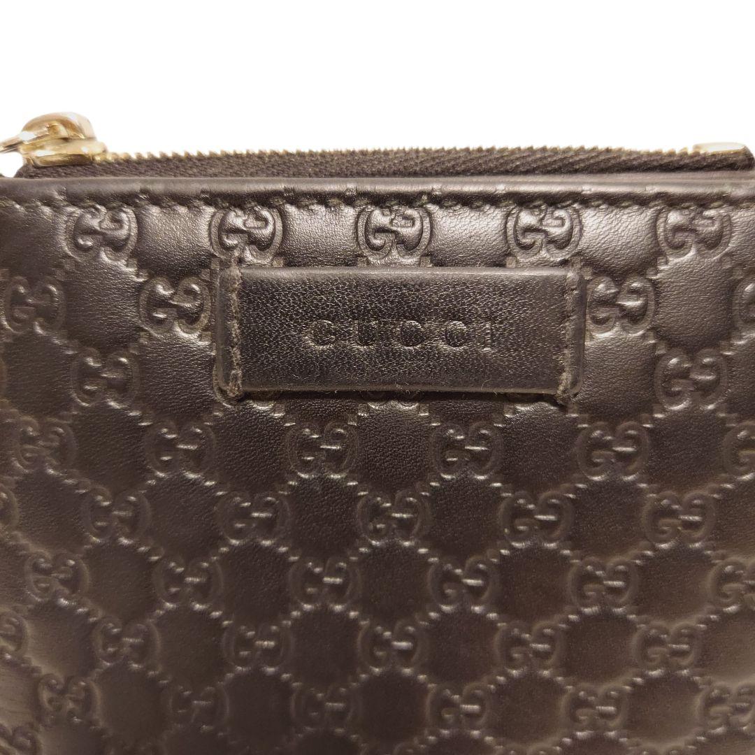 【GUCCI】2つ折り財布 黒 マイクロ レザー 型押し